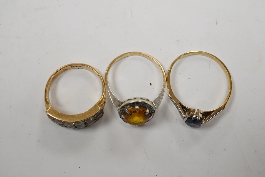 An 18ct and single stone sapphire set ring, with diamond chip set shoulders and two other rings including 18ct and split pearl cluster. Condition - poor to fair